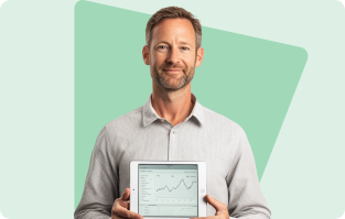 Man holding a tablet displaying a financial graph, standing in front of a green abstract background.